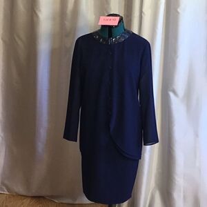 2 piece suit with skirt & jacket in size 8 jacket has jeweled neckline